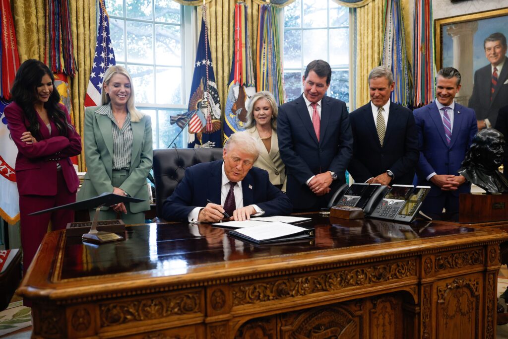 President Donald Trump signs a presidential memorandum in the Oval Office on Sept. 15, 2025 in Washington, D.C. Also pictured from left to right are Secretary of Homeland Security Kristi Noem, Attorney General Pam Bondi, Sen. Marsha Blackburn, R-Tenn., Sen. Bill Hagerty, R-Tenn., Tennessee Gov. Bill Lee and U.S. Secretary of Defense Pete Hegseth. (Photo by Kevin Dietsch/Getty Images)