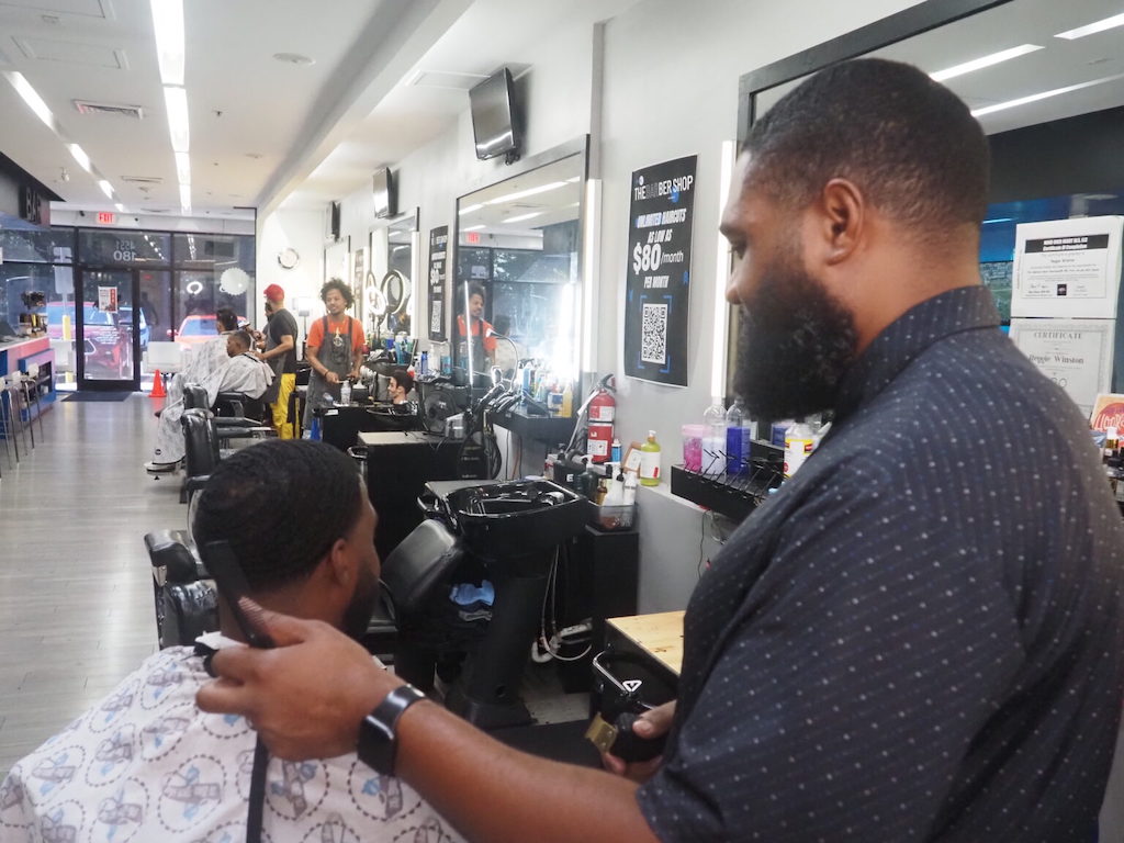 A barber cuts hair.