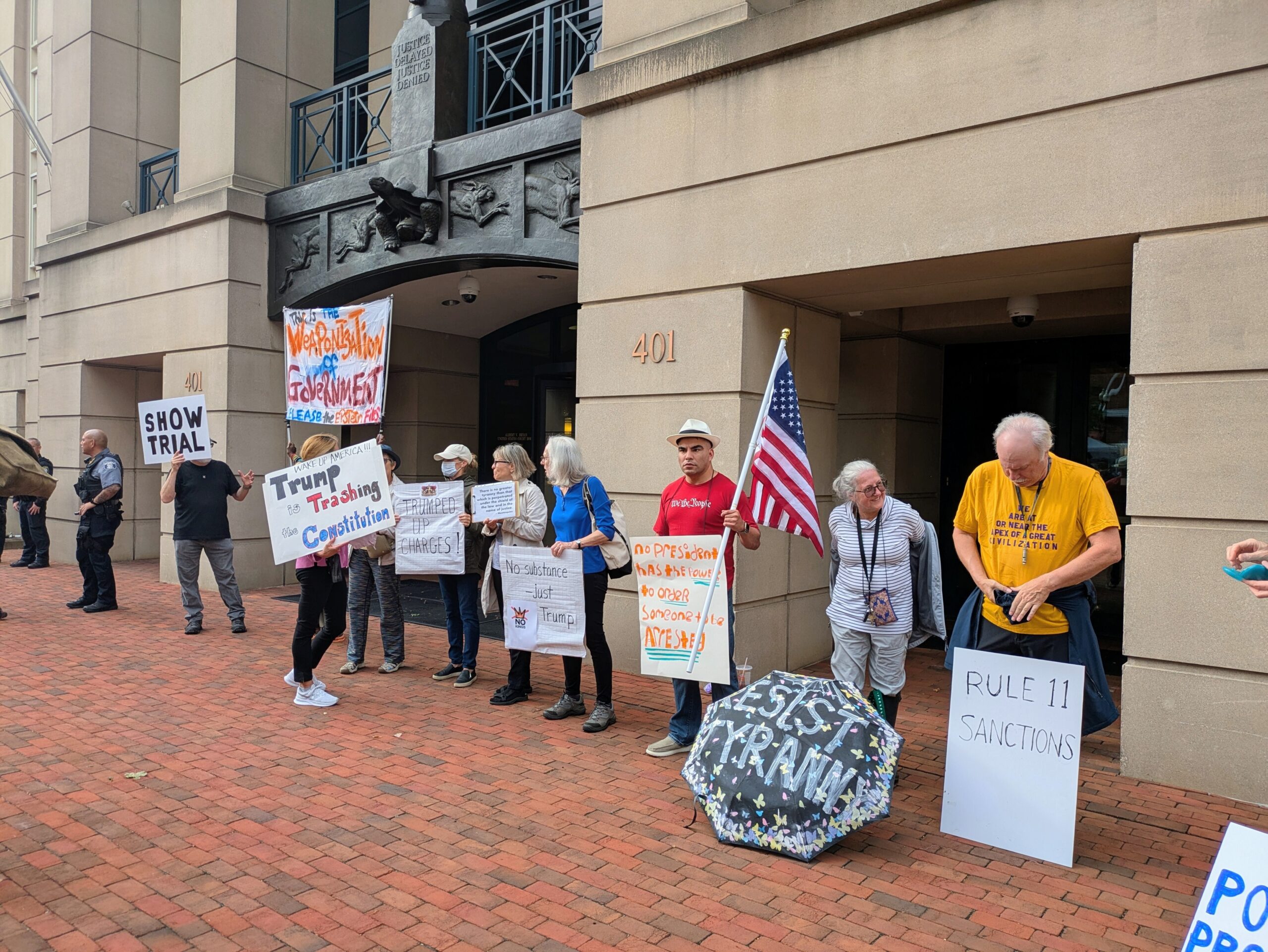 Protesters demonstrated outside the Eastern District of Virginia federal courthouse in Alexandria ahead of the arraignment of former FBI Director James Comey on Wednesday, Oct. 8, 2025. (Photo by Ashley Murray/States Newsroom)