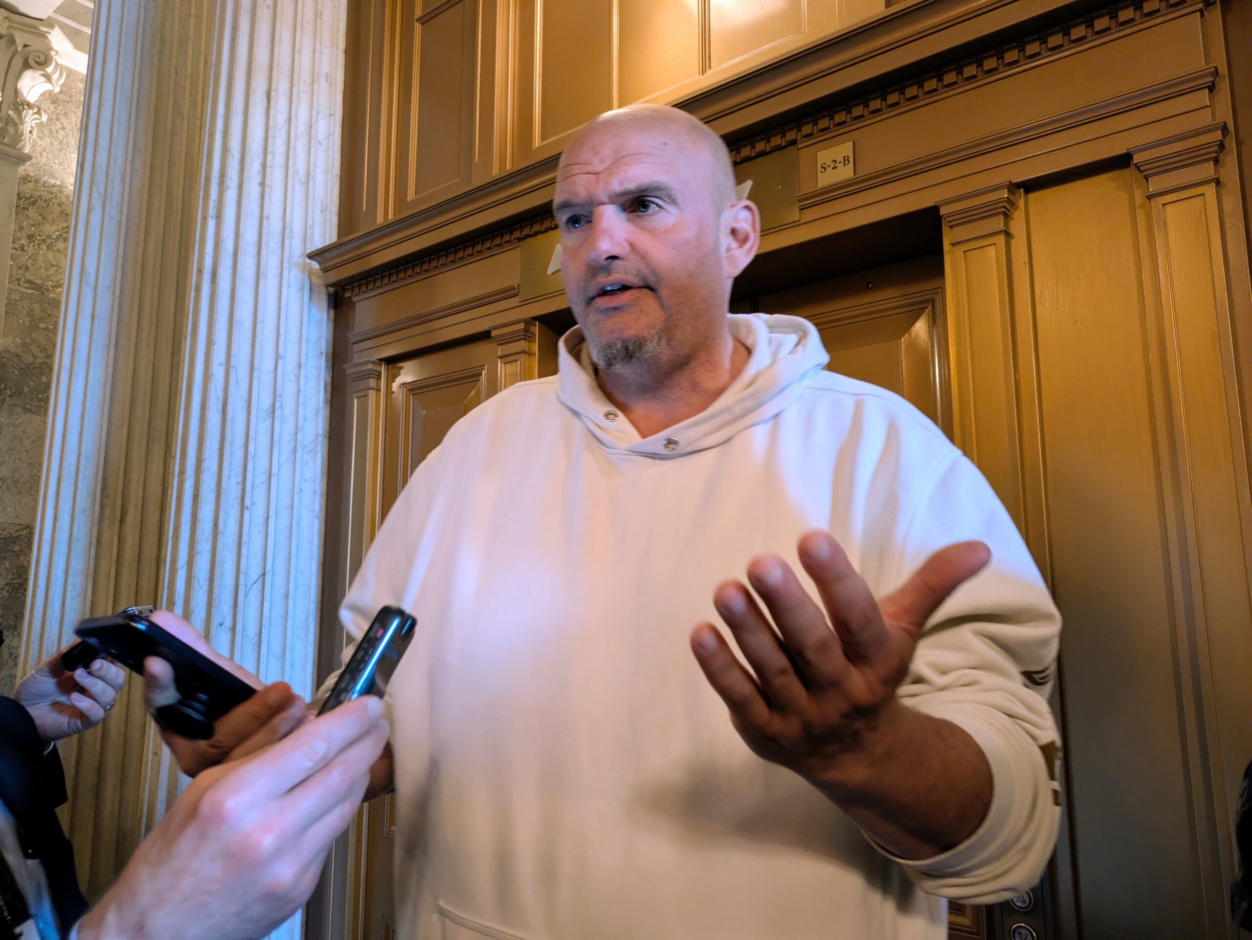 Sen. John Fetterman, a Pennsylvania Democrat, answers questions from reporters in the U.S. Capitol on Oct. 3, 2025. (Photo by Ashley Murray/States Newsroom)