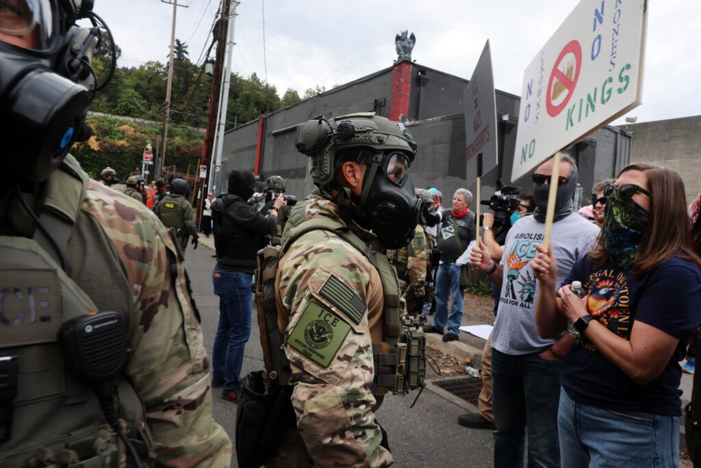 Federal agents, including members of the Department of Homeland Security, the Border Patrol, and police, attempt to keep protesters back outside a downtown U.S. Immigration and Customs Enforcement facility on Oct. 4, 2025 in Portland, Oregon.  (Photo by Spencer Platt/Getty Images)